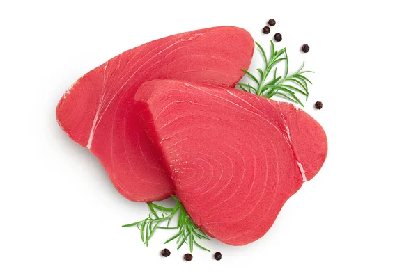 Fresh tuna fish fillet steak with rosemary and peppercorns isolated on white background with clipping path. Top view. Flat lay