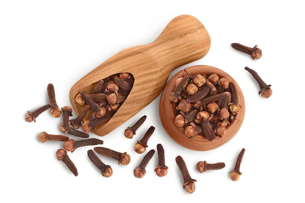 Dry spice cloves in wooden bowl and scoop isolated on white background with clipping path. Top view. Flat lay — Stock Photo, Image