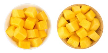 mango diced in ceramic bowl isolated on white background. Top view. Flat lay.