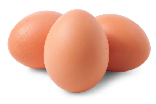 Três ovos castanhos isolados em branco — Fotografia de Stock