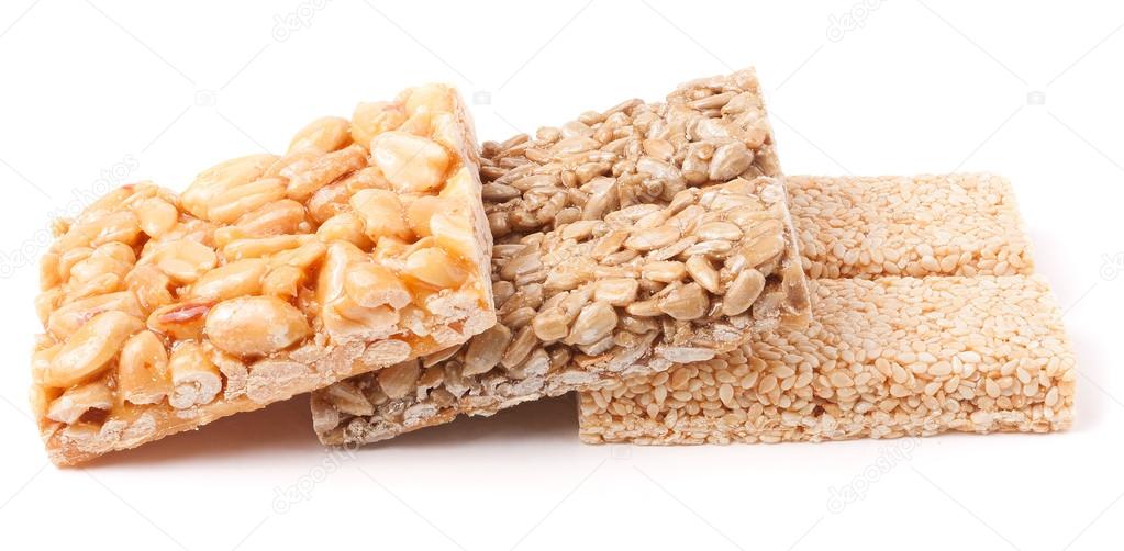 Honey bars with peanuts, sesame and sunflower seeds — Stock Photo © kolesnikovserg 92125434