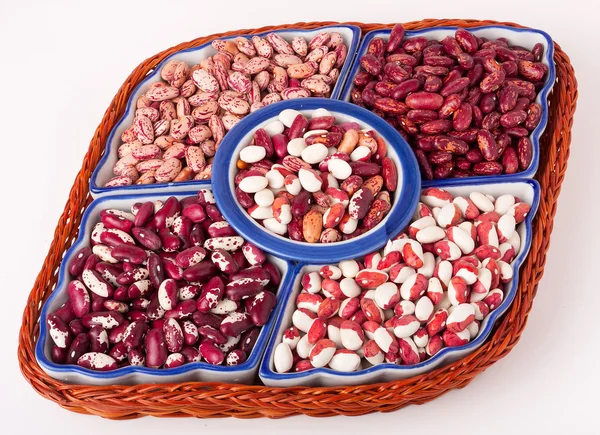 kidney beans on white background in a wicker plate