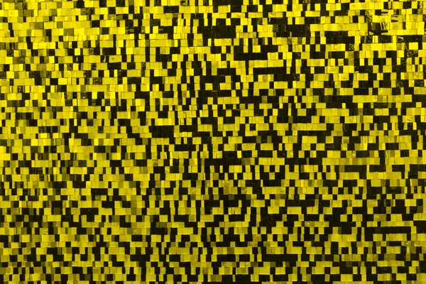 Black and yellow square tiles. Abstract background.