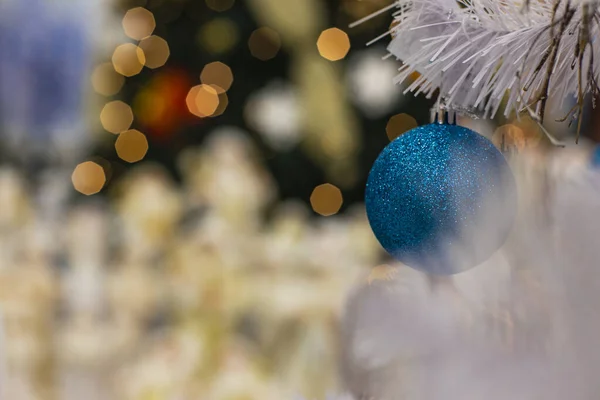 Christmas background poster picture with white tree blue ball toy decoration and blurred bokeh golden lights wallpaper concept picture