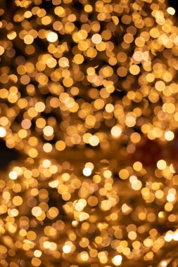 Altın bokeh aydınlatması Noel çelengi lambaları dikey olmayan konsept duvar kağıdı