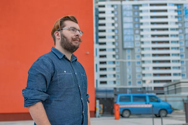 business boss bearded big man portrait on construction area landmark background urban view with small bus object