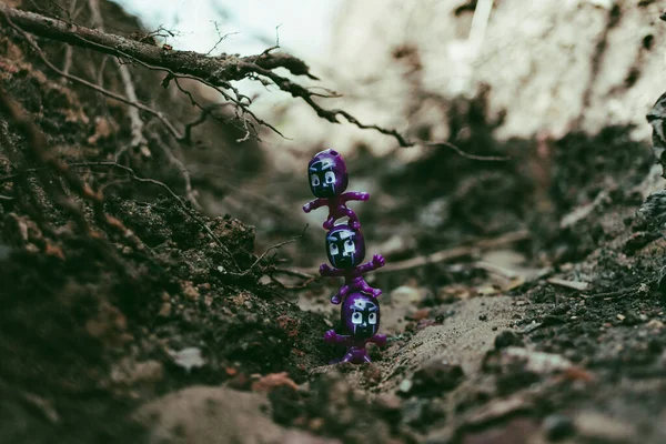 ninja figurines standing on each other