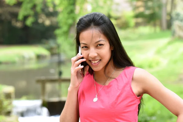 Young woman calling phone Stock Picture