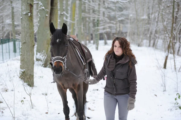 young woman riding in the snow