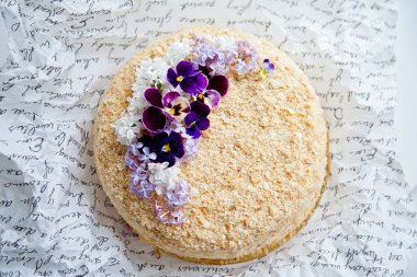 Napoleon cake decorated with flowers clipart