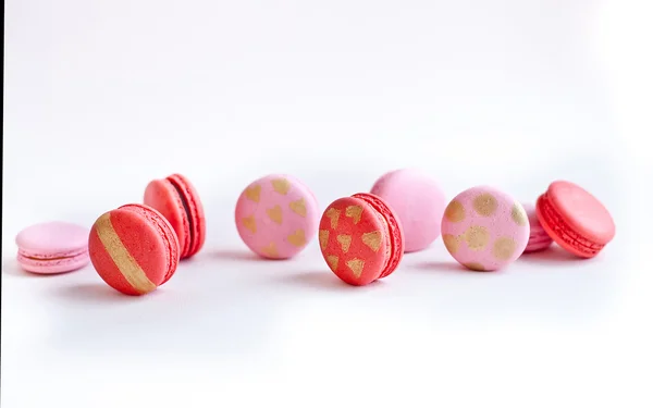 Macarons with golden hearts accents — Stock Photo, Image