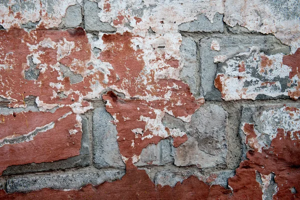 Kırmızı boyalı eski yıpranmış duvar — Stok fotoğraf