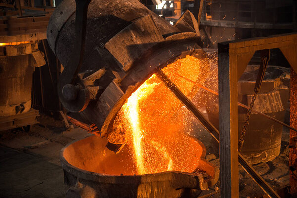 Tank pours liquid metal at the steel mill