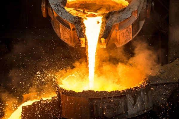 Tank pours liquid metal at the steel mill