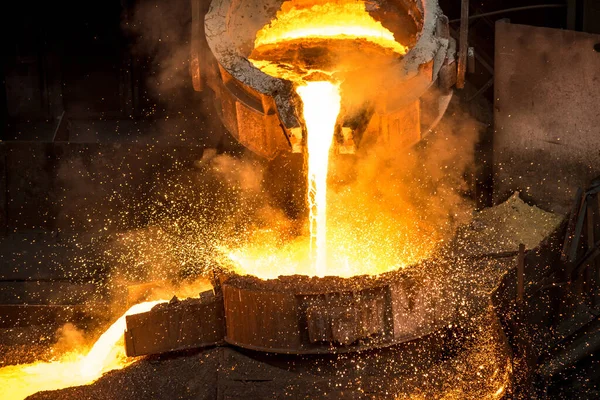 Tank pours liquid metal at the steel mill