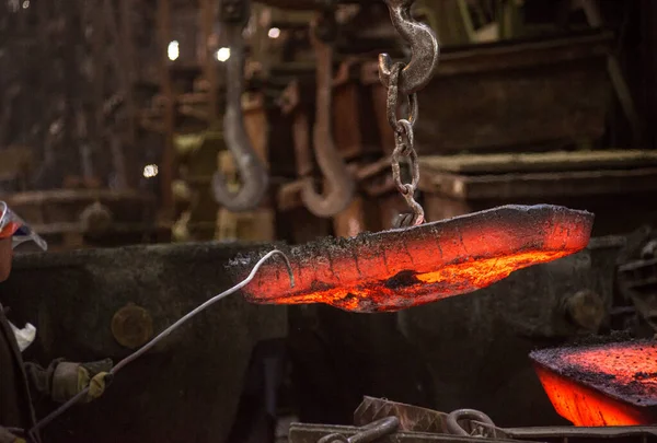 Steelworker at work at a steel mill