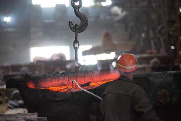 Steelworker at work at a steel mill