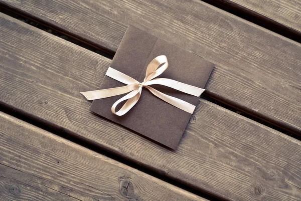 Gift envelope on the wooden floor