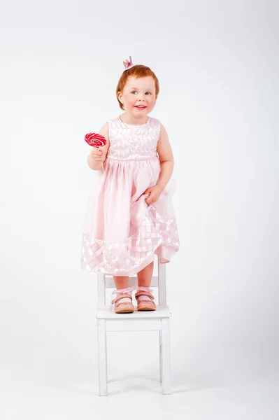 Niña con bastón de caramelo — Foto de Stock