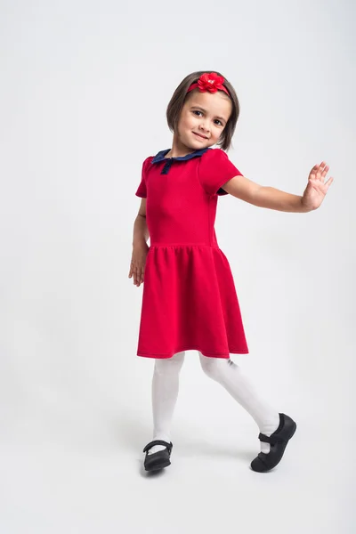 Beautiful little Girl smiling in red dress — Stock Photo, Image