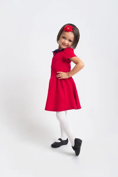 Beautiful little Girl smiling in red dress — Stock Photo, Image