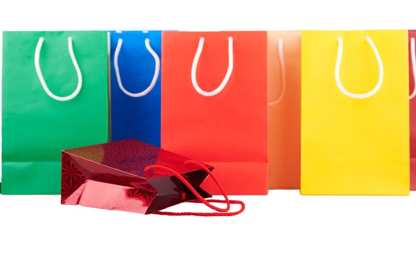 Colorful shopping bags in paper isolated on white — Stock Photo, Image