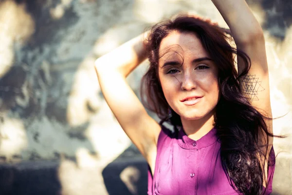 Portrait of girl with shadow from sun light rays