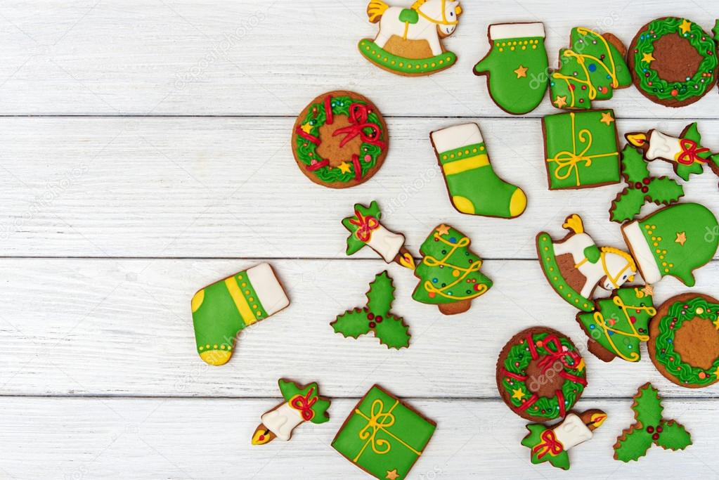 Christmas green gingerbread cookies on wooden background