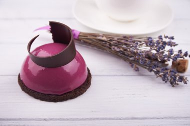 Mini cake with black currant and creamy mousse.