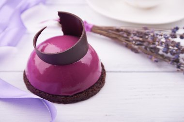 Mini cake with black currant and creamy mousse.