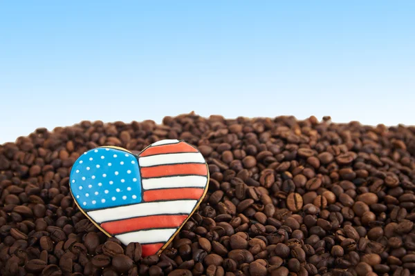 close view at gingerbread heart shaped and coffee beans