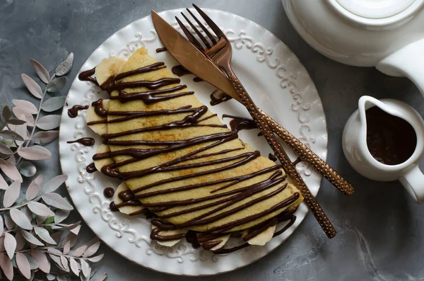 Oatmeal for breakfast with chocolate paste and banana