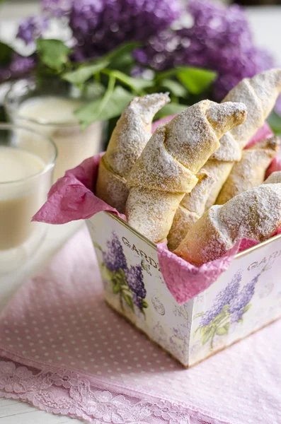 Croissants with milk and lilac — Stock Photo, Image