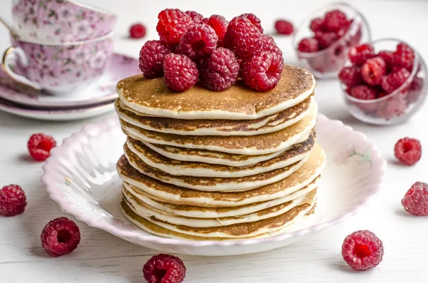 Pancake with sauce and raspberries — Stock Image Pancake with sauce and raspberries Stock Image