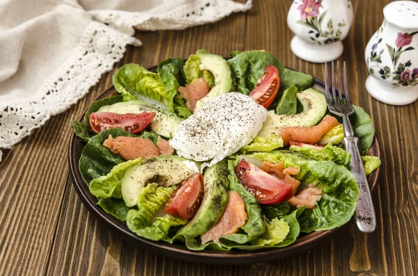 Avocado Salad with Romano tomato salmon and poached egg seasoned — Stock Photo, Image