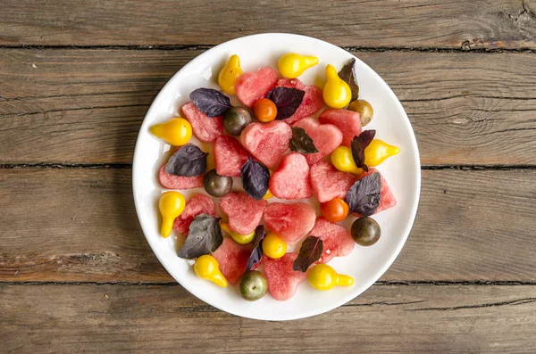 Watermelon salad with feta cheese and basil tomatoes with balsamic dressing — Stock Photo, Image