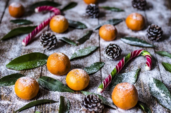 Christmas screensaver with tangerines and sweets — Stock Photo, Image