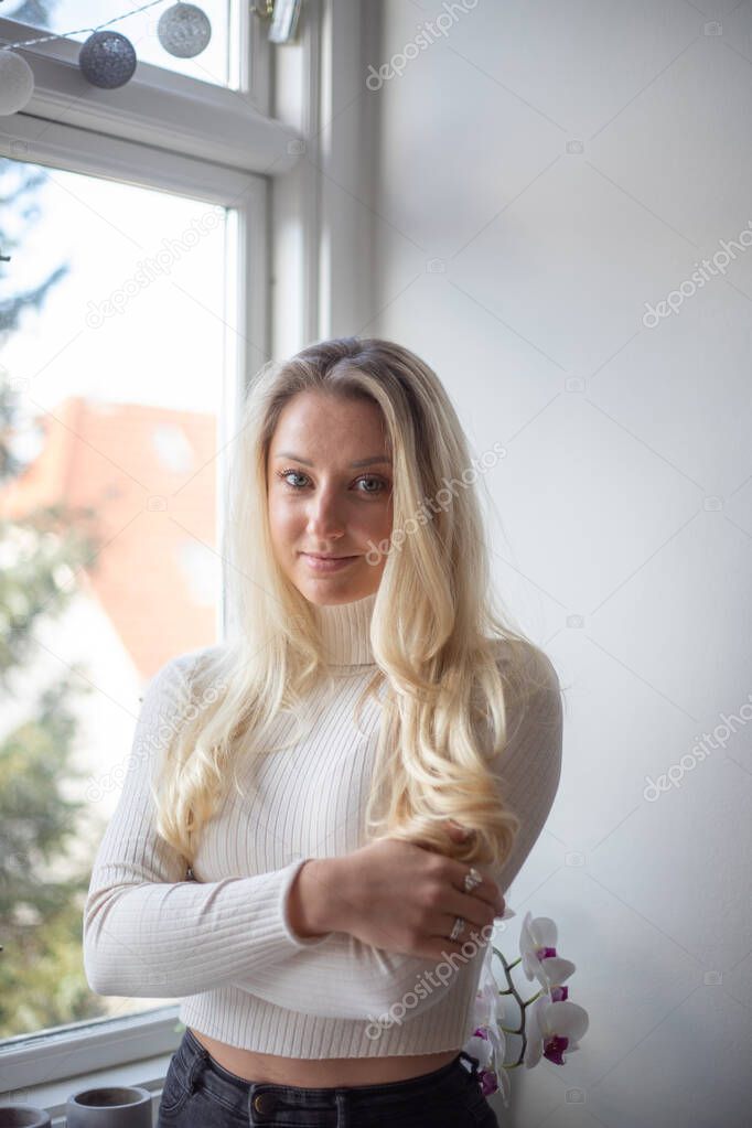 Portrait of a beautiful caucasian girl with long blond hair