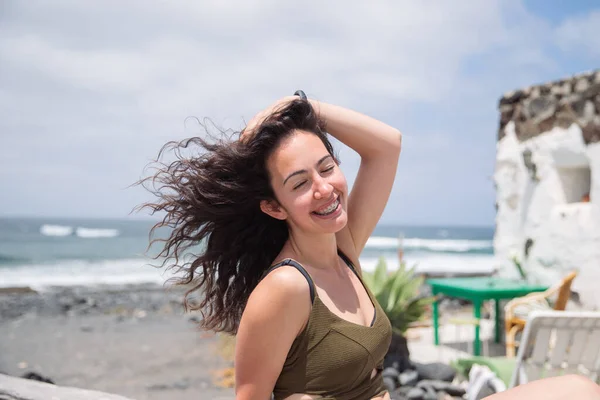 Smiling Girl Her Hand Touches Her Hair Blown Wind Carefree — Stock fotografie