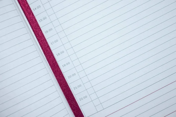 Opened notebook with bookmark close up