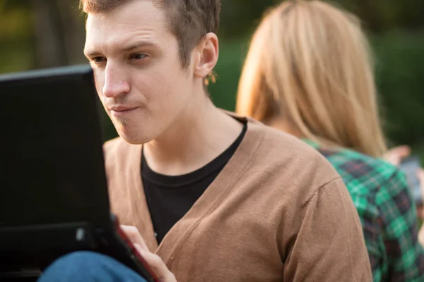 young man using laptop