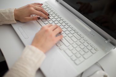 worker hands with laptop