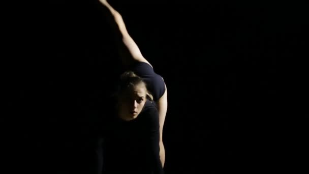 Female gracefully dancing contemporary on black background — Stock Video