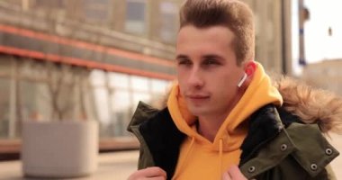 Man warming his body in a winter city