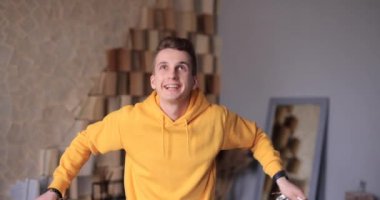 Man throwing confetti, celebrate holiday at home, slow motion 4k at 120fps