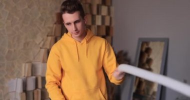 Man inflates a balloon and makes a dog
