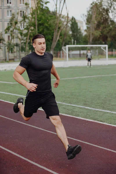 Man run on a stadium — Stock Photo, Image