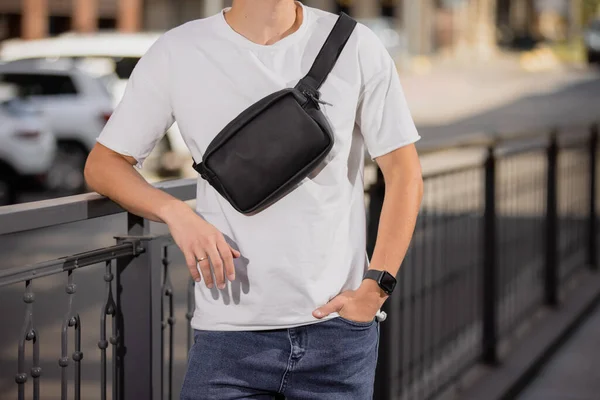 Cropped Unrecognizable Man Holding His New Black Leather Banana Bag — Stock Photo, Image