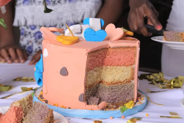 Sliced cake for the birth day and other parties that some of it has been eaten off