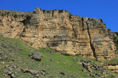 Azerbaijan. Beautiful spring mountains. Old caves in the rock. Sundu village. Shemakha district.
